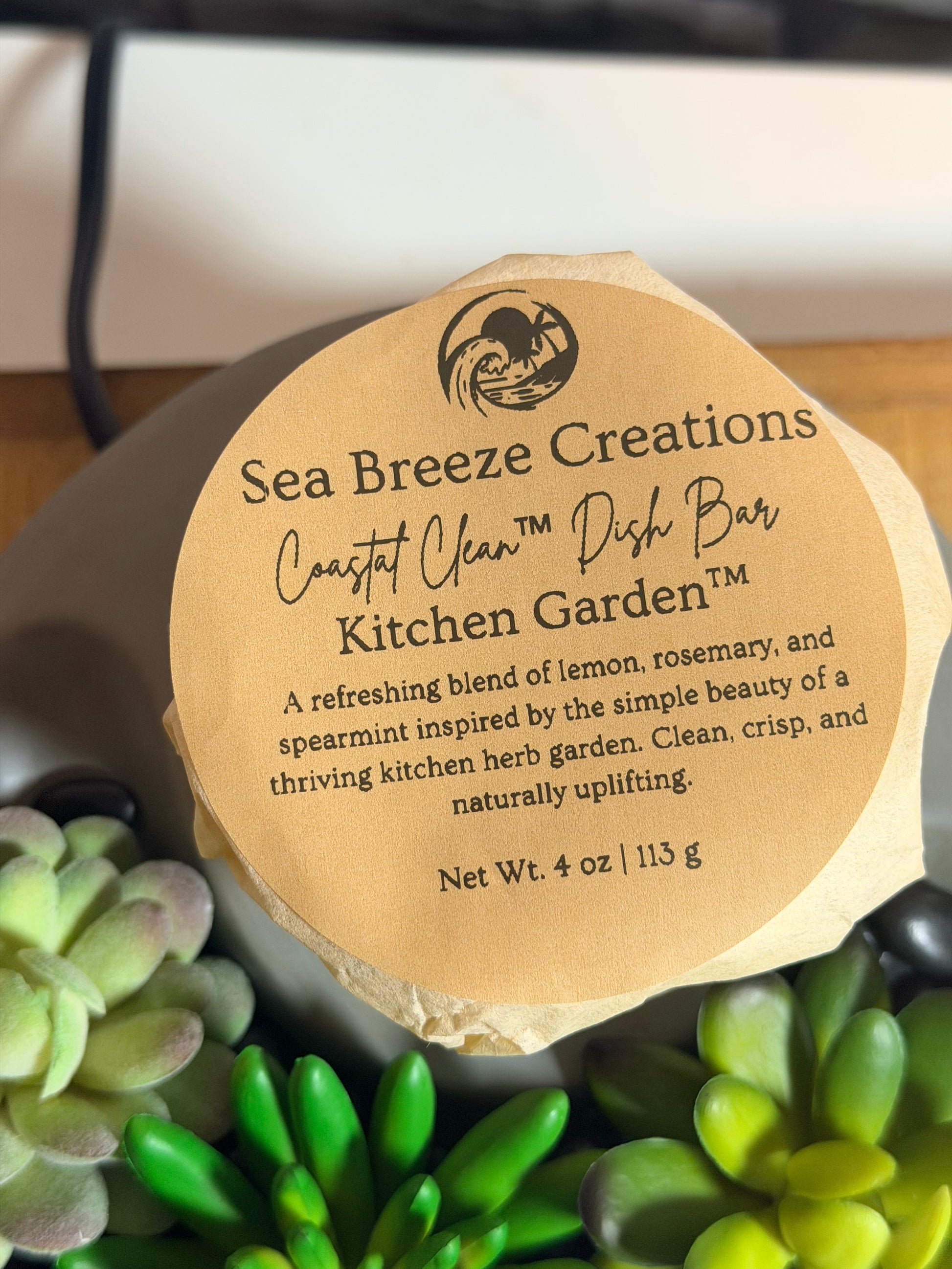 Sea Breeze Creations soap bar with a label surrounded by succulents