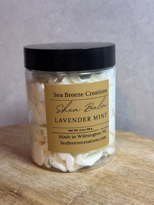 Jar of shea balm with a label on a wooden surface